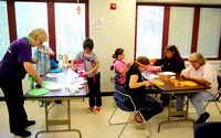 Veteran quilters give kids some guidance on scarf project