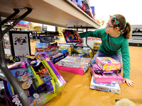 Public safety officials help local children pick out Christmas presents during annual events