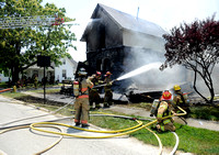 Fast-spreading fire damages home