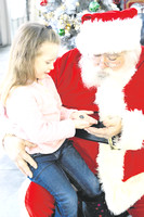 Area youngsters visit with Santa and Mrs. Clause at Pendleton Fall Creek fire station