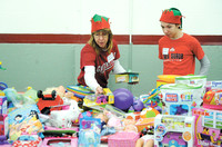 Volunteers grant wishes at toy, clothing giveaway