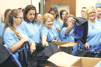 Donation provides duffel bags to youths in foster care