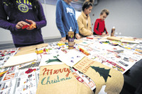 Volunteers stuff stockings for children in need