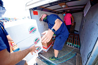 STOCKING UP: Volunteers gather tons of food to distribute to local pantries