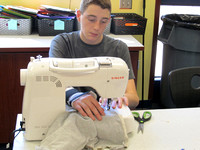 Students up-cycle T-shirts to make diapers for kids in Haiti