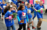 Flower parade becomes a soggy celebration